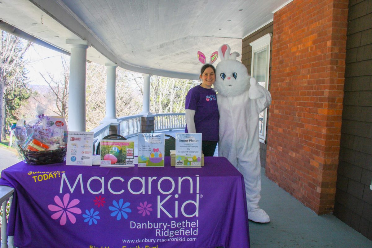 Sponsored by Macaroni Kid meghan frieland and the Easter bunny post for a photo on the veranda