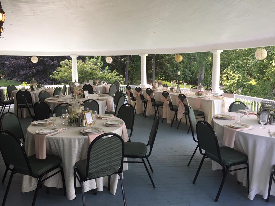 Weddings at Tarrywile Mansion veranda set up with guest seating and the head table